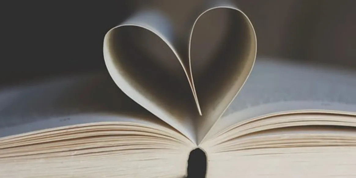 Pages of a book folded into a heart.